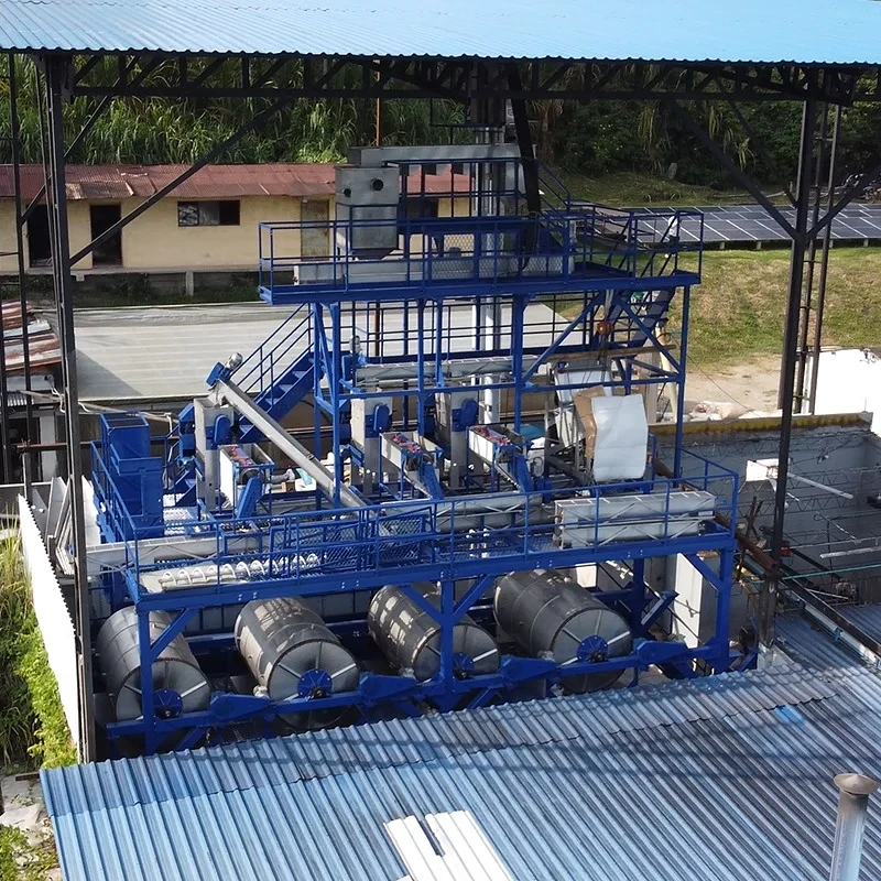 Coffee processing machinery under a roof at El Vergel Estate